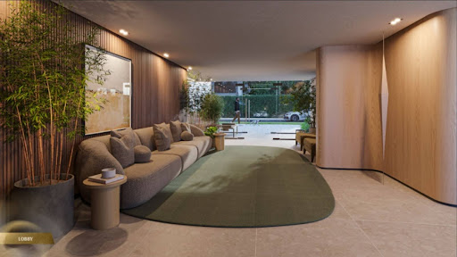 Lobby com sofá curvo, plantas decorativas e saída envidraçada para área externa arborizada.
